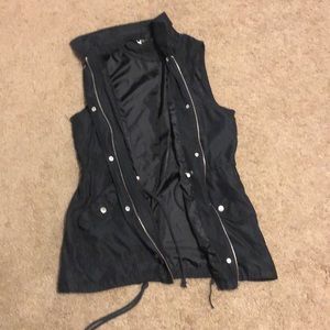Black zip up and button up vest